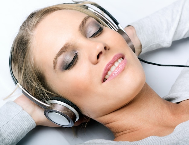 Woman relaxing to music