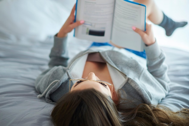 Woman relaxing with morning readings