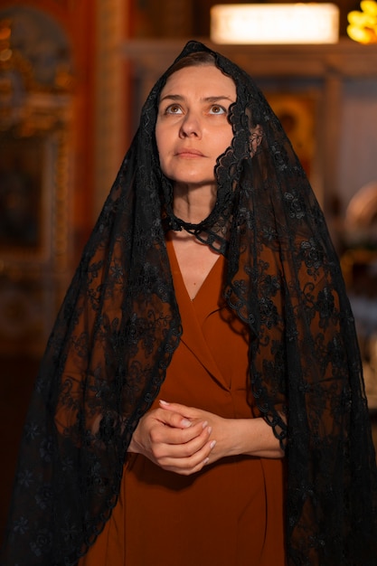 Woman during religious pilgrimage at the church