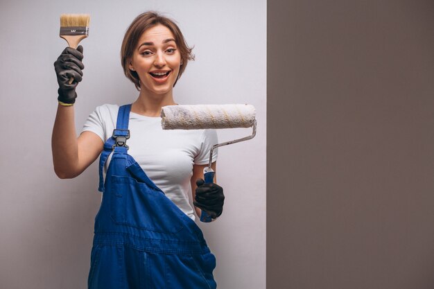 Woman repairer with painting roller isolated