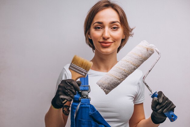 Woman repairer with painting roller isolated