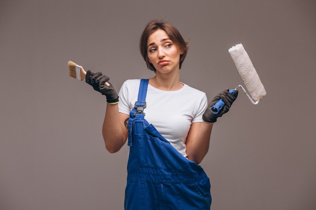 Woman repairer with painting roller isolated