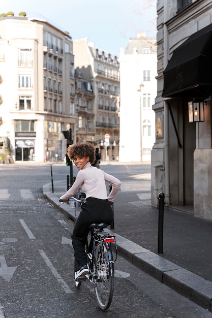 Woman riding the bike in the city in france