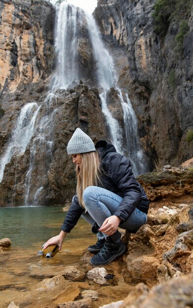 Woman at river collection water