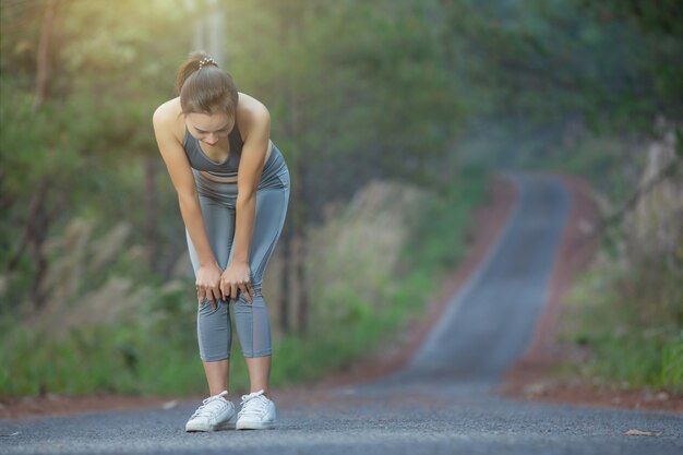 woman runner hold Knee Pain