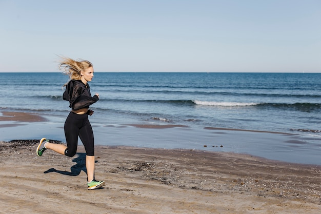 Woman running at the beach