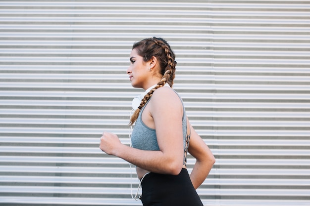 Woman running near fence