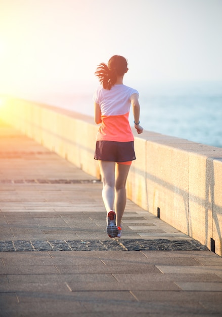 Woman running at promenade