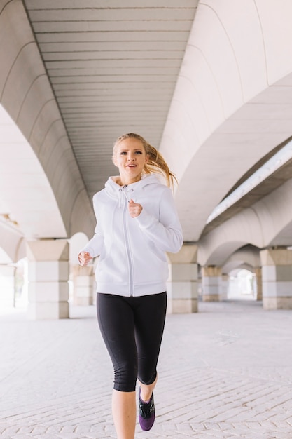 Woman running and smiling