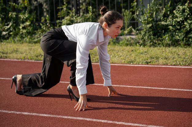 Woman running in suit full shot