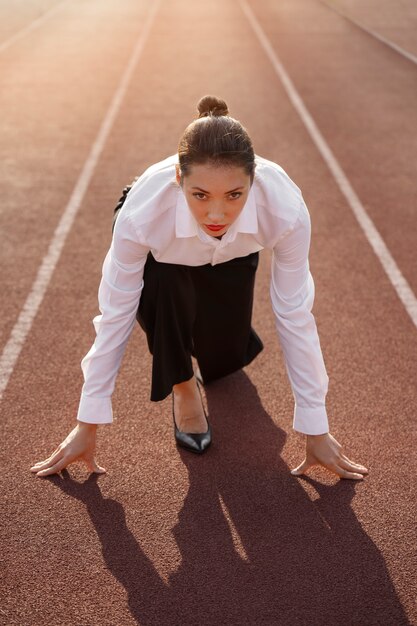 Woman running in suit full shot