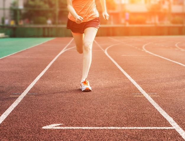 Woman running on a track