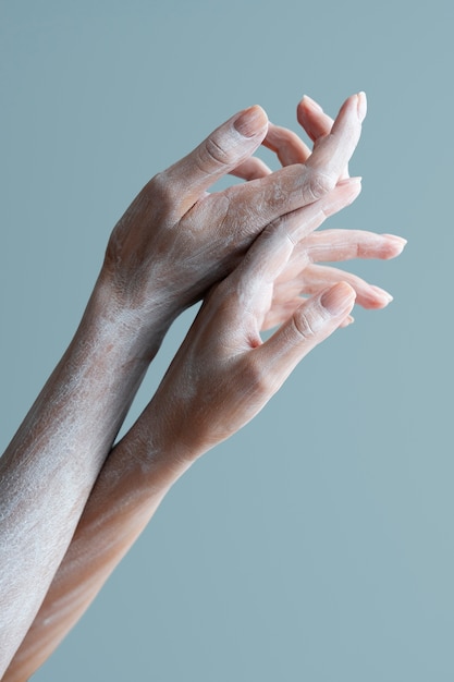 Woman's arms with white powder