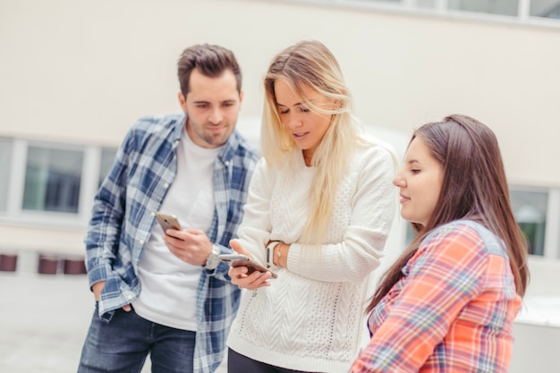 Woman's friends looking at her phone