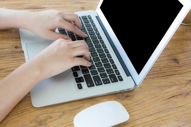 Woman's hands working with laptop