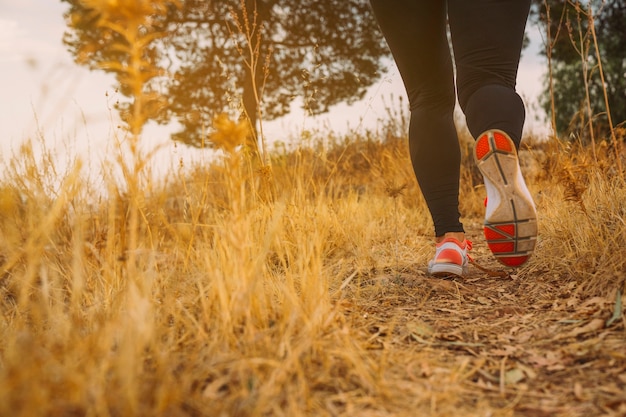 Woman's legs running in the morning