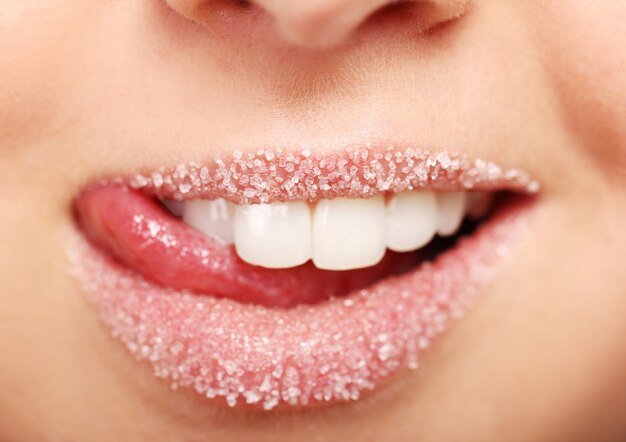 Woman's lips covered with sugar