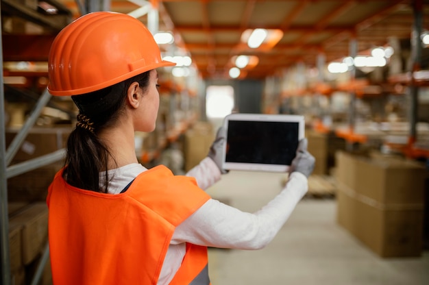 Woman in safety equipment working