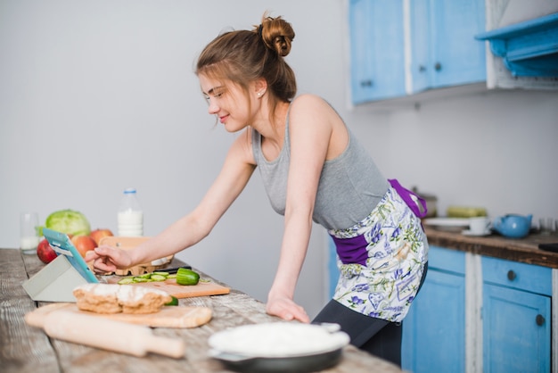 Woman searching for recipe in Internet