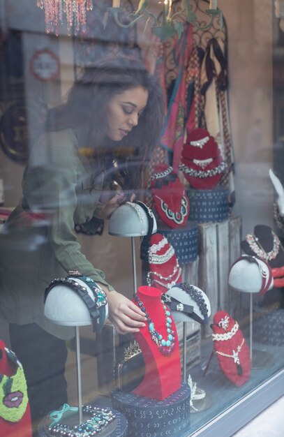 Woman selecting accessories in jewelry section