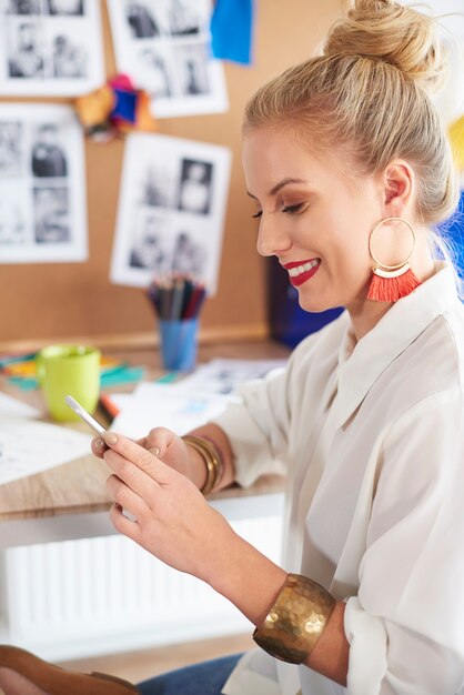 Woman sending messages by the smartphone