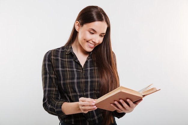 Woman in shirt reading book