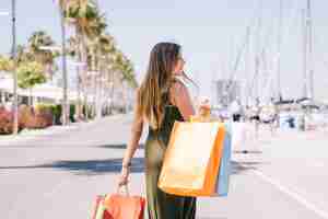 Free photo woman shopping outdoors