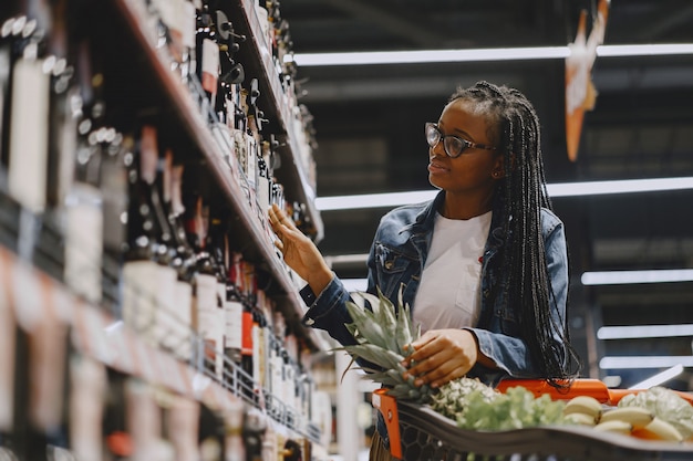 Woman shopping vegetables at the supermarket