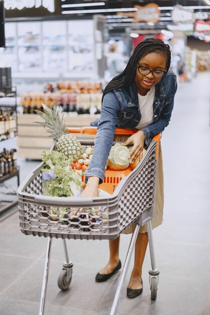 Woman shopping vegetables at the supermarket