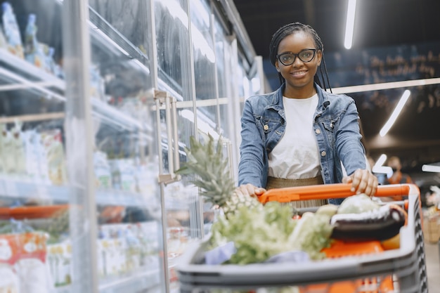 Woman shopping vegetables at the supermarket