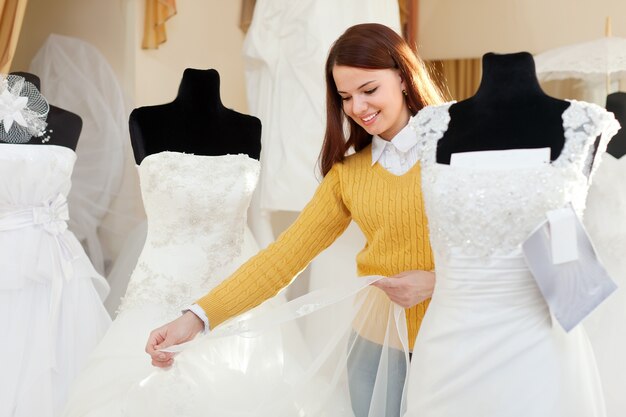 woman shopping for wedding outfit in bridal boutique