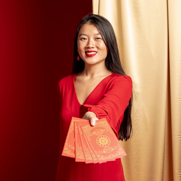 Woman showing cards for chinese new year