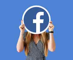 Free photo woman showing a facebook icon