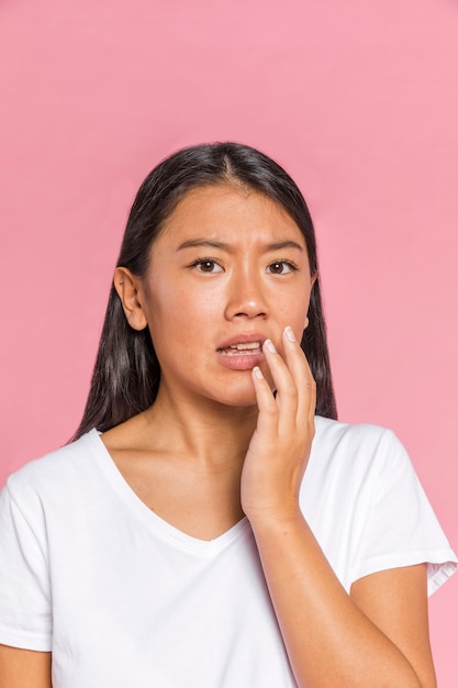 Woman showing fear and looking at camera