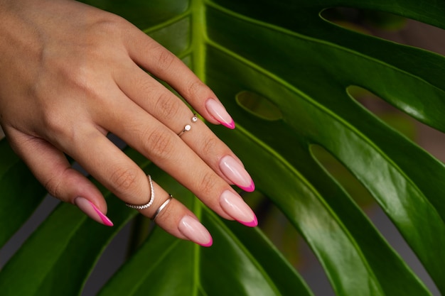 Woman showing her nail art on fingernails