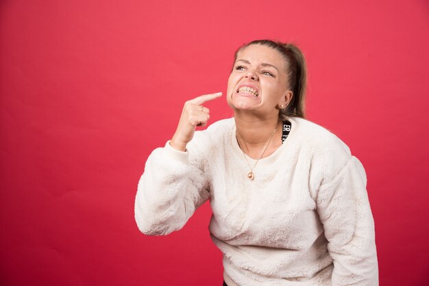 Woman showing her perfect straight white teeth