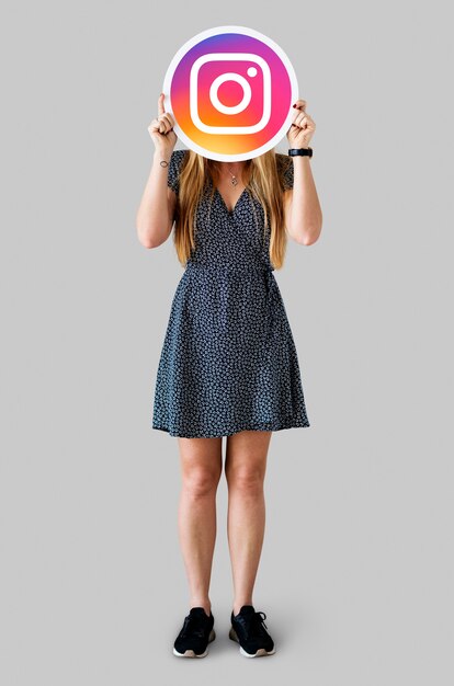 woman showing an instagram icon