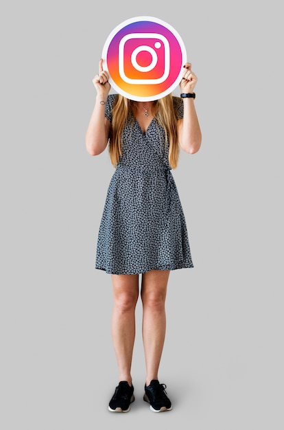 Free photo woman showing an instagram icon