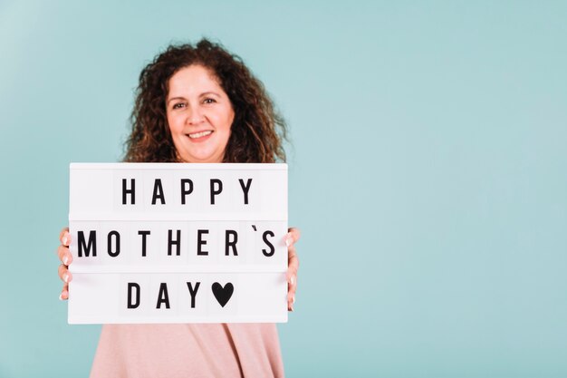 Woman showing Mother's Day greetings