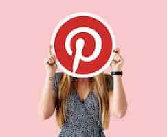 Free photo woman showing a pinterest icon