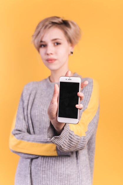 Woman showing smartphone