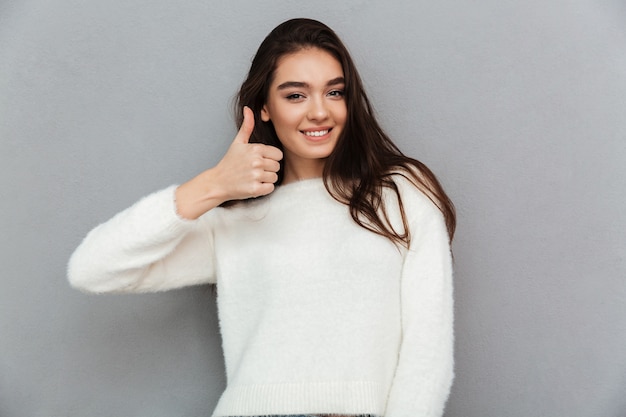 Woman showing thumbs up sign