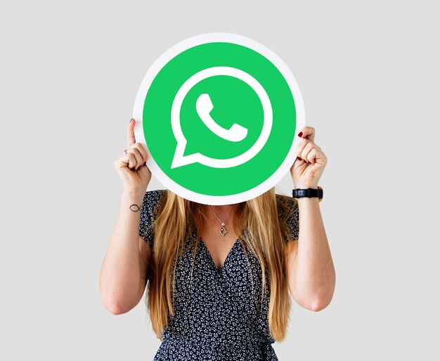 Woman showing a WhatsApp Messenger icon