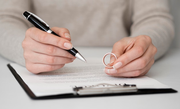 Free photo woman signing divorce contract