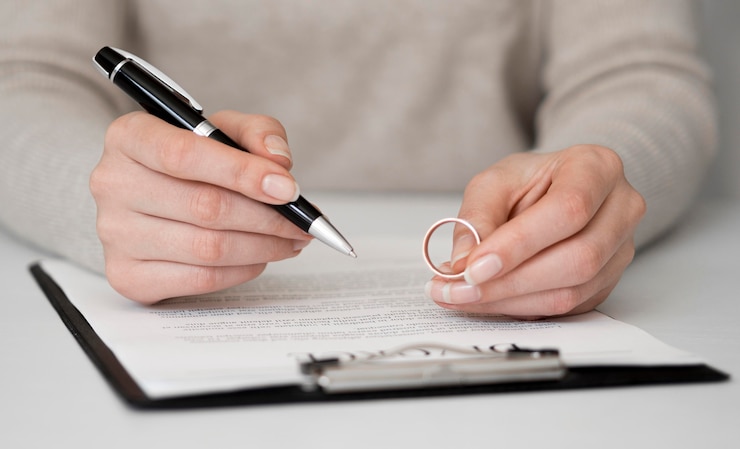 Free Photo woman signing divorce contract
