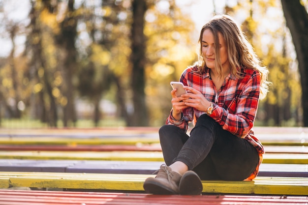 Woman sitting on a bench in park