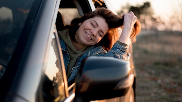 Woman sitting in a car front view