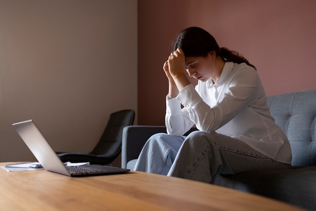 Woman Sitting On Couch Side View