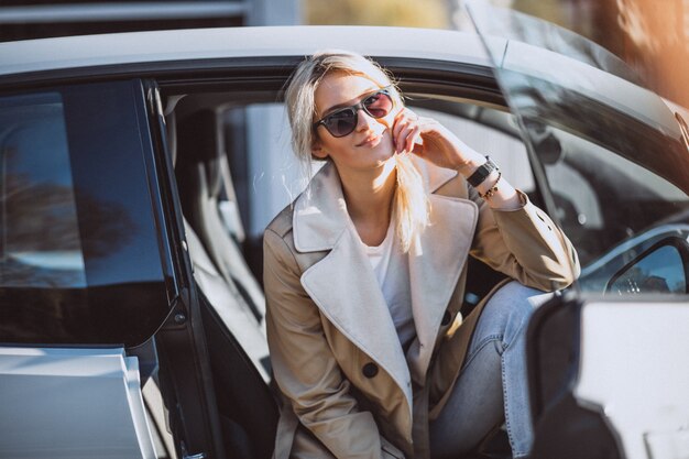 Woman sitting in electo car