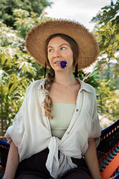 Woman sitting in hammock medium shot